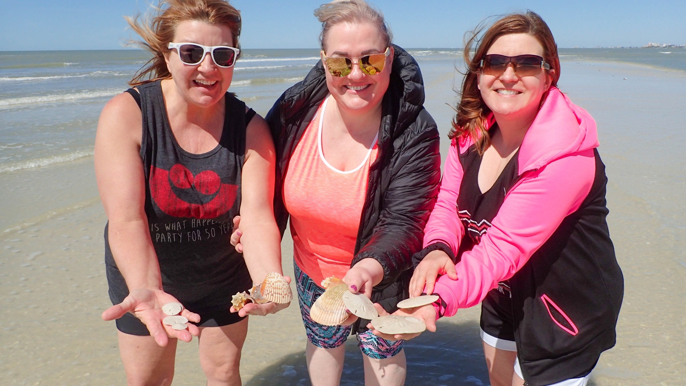 a couple of people that are standing in the water