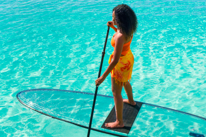 a person standing in front of a body of water